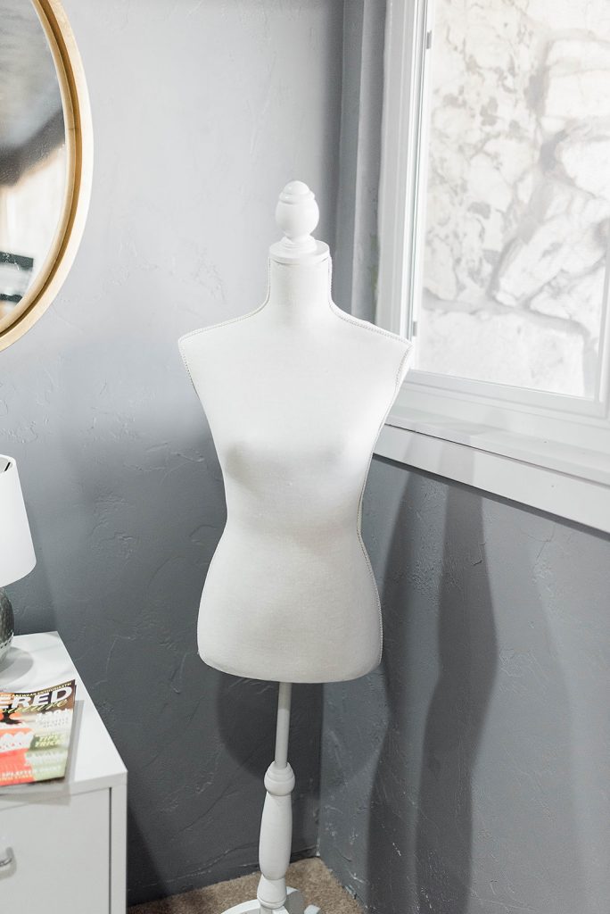 white mannequin in a sewing room