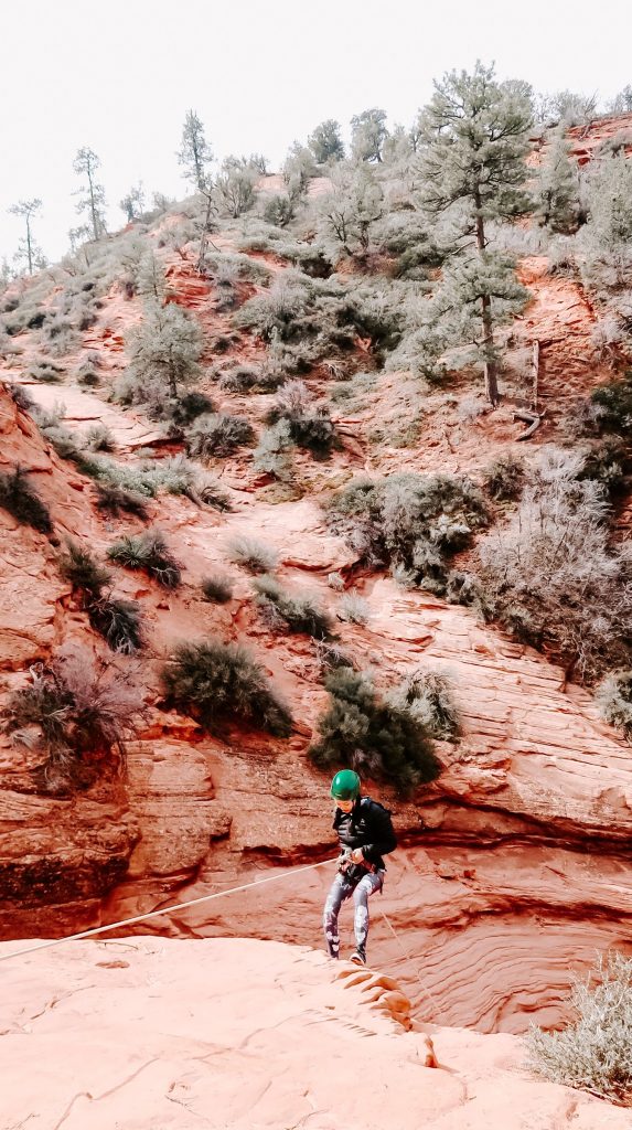 woman rappelling at zion