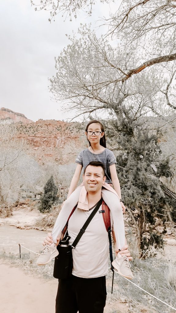 daughter on father's shoulder at zion